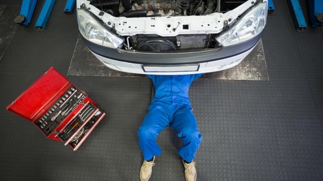 A mechanic laid under a car